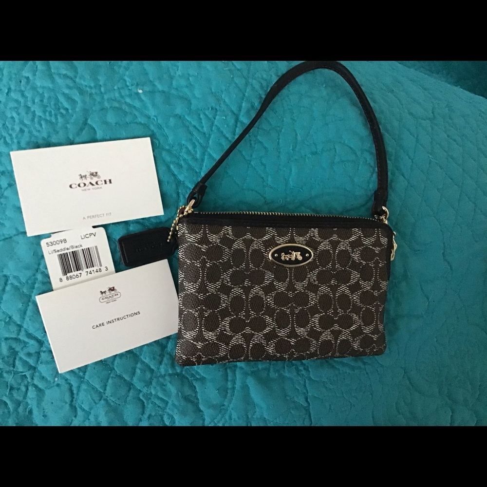 Authentic coach wristlet! New never used color saddle black